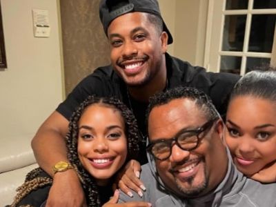 Donielle, Dominic, and Dia Nash are all hugging their father, Don Nash in the picture.